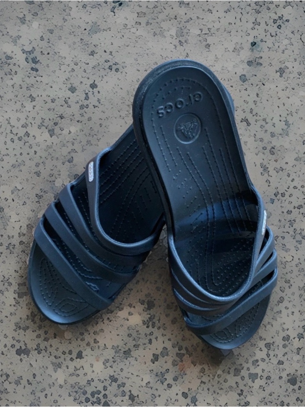 Black Crocs Rhonda strappy wedge slide sandals featuring an open toe design. 10w